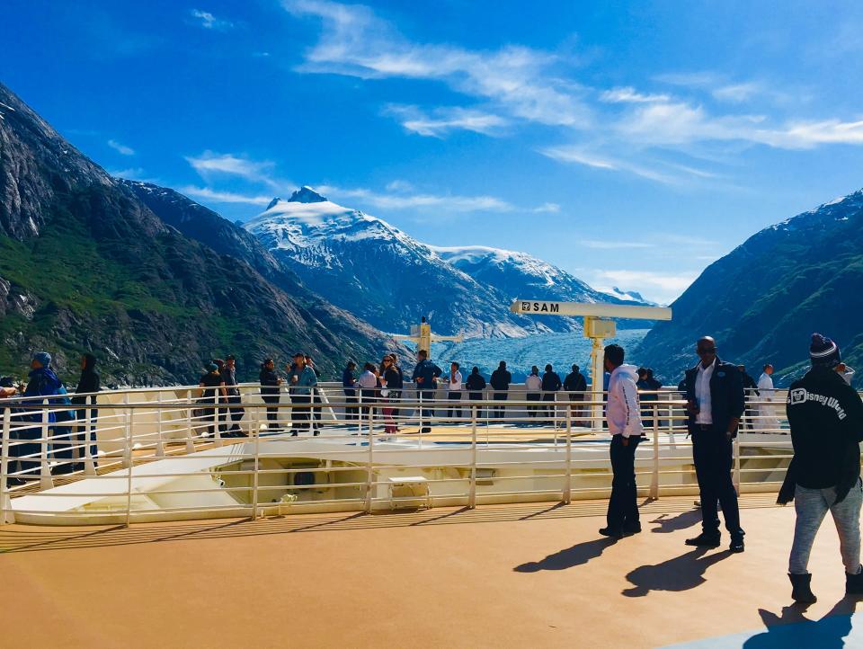 a view of mountains and water off the front of a ship