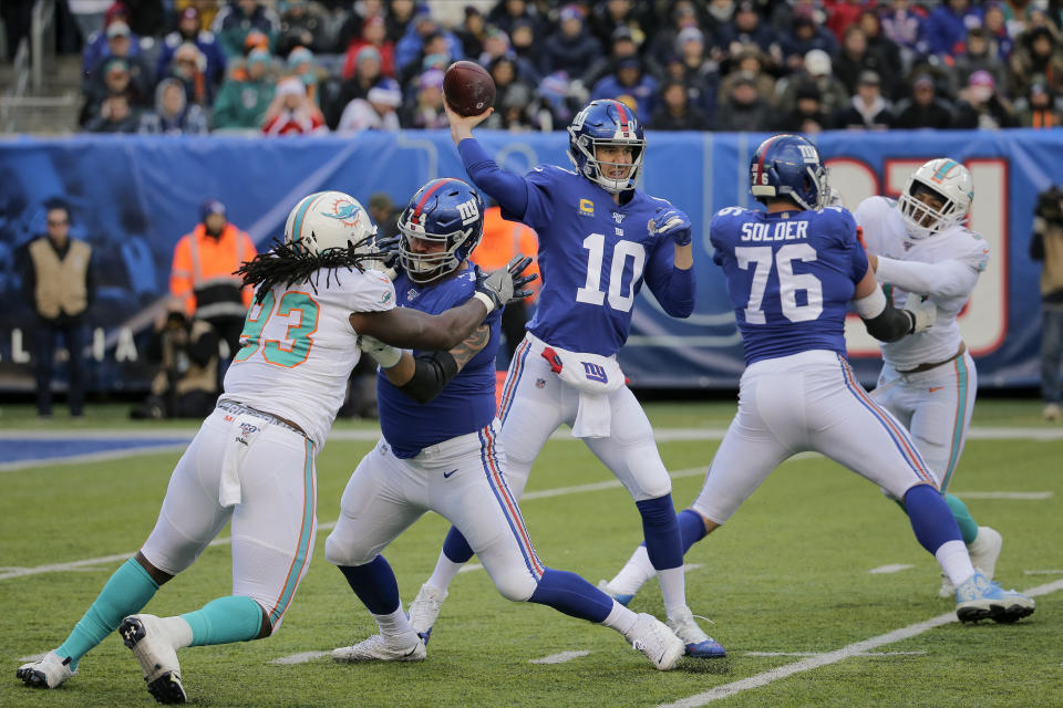 New York Giants quarterback Eli Manning (10) passes against the Miami Dolphins during the second quarter of an NFL football game, Sunday, Dec. 15, 2019, in East Rutherford, N.J. (AP Photo/Seth Wenig)