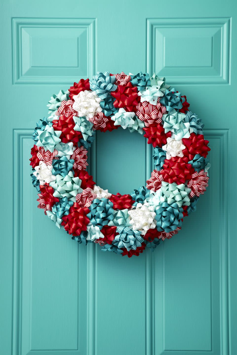 <p>For a burst of color, embellish a plain foam wreath with leftover bows from last year's wrapping. Use a combination of red, white and blue colors, while sprinkling in a few striped picks. </p><p><a class="link " href="https://www.amazon.com/Tatuo-Christmas-Metallic-Adhesive-Decorating/dp/B07HSZ6PXX/?tag=syn-yahoo-20&ascsubtag=%5Bartid%7C10067.g.42146682%5Bsrc%7Cyahoo-us" rel="nofollow noopener" target="_blank" data-ylk="slk:Shop Now">Shop Now</a><br></p>