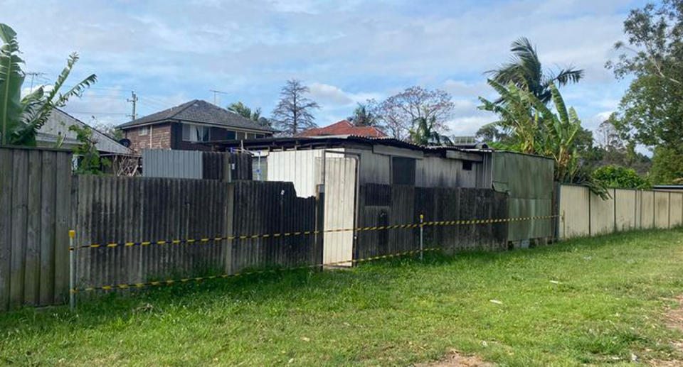 Old fibro fence tapped off on Sydney property. 