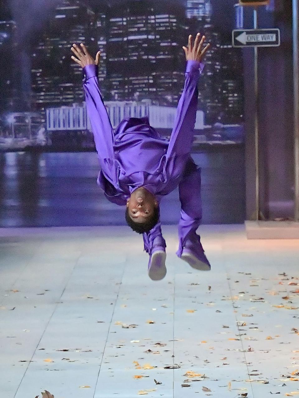 Alton Mason backflips down the runway in Milan for Louis Vuitton's fall 2020 menswear show.