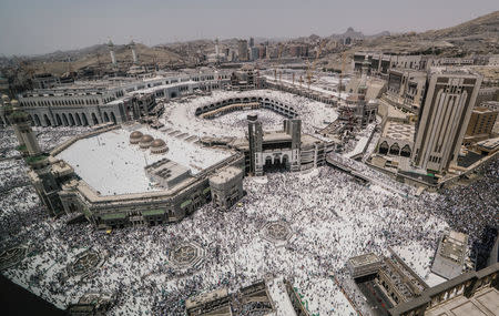 Muslim pilgrims walk out after the Friday prayer at the Grand mosque ahead of annual Haj pilgrimage in the holy city of Mecca, Saudi Arabia August 17, 2018. REUTERS/Zohra Bensemra