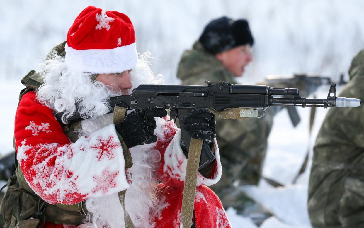 Soldiers dressed as Father Frost (Russian Santa Clause) run an obstacle course organized by the Russian National Guard during the holiday season - Danil Aikin /TASS