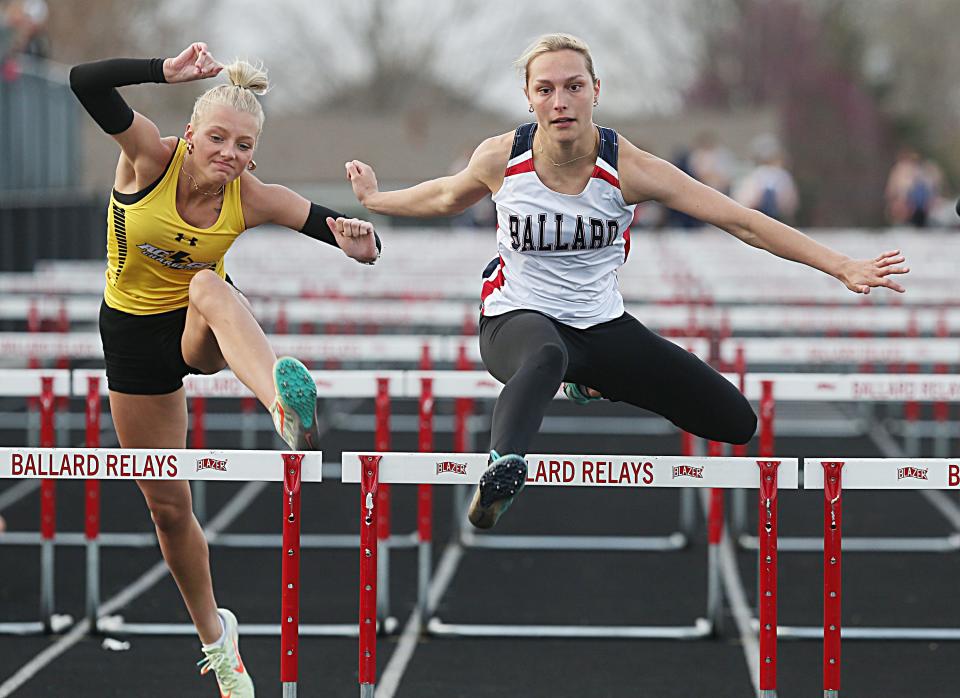 Ballard's Ally Baker and ACGC's Saige O'Brien battle for first during the girls' 100-meter hurdles at the Bomber Relays on Tuesday, April 18, 2023, in Huxley, Iowa. Baker won in 17.66 seconds.