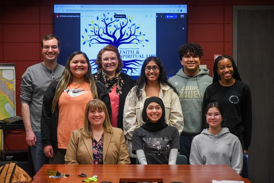 Interfaith Council members and supervisors pose for photos after weekly council meeting on Tuesday, Feb, 20, 2024 at Augustana Humanities Building in Sioux Falls.