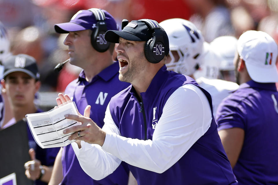 Northwestern interim head coach David Braun directs his team against Rutgers during the first half of an NCAA college football game, Sunday, Sept. 3, 2023, in Piscataway, N.J. (AP Photo/Adam Hunger)