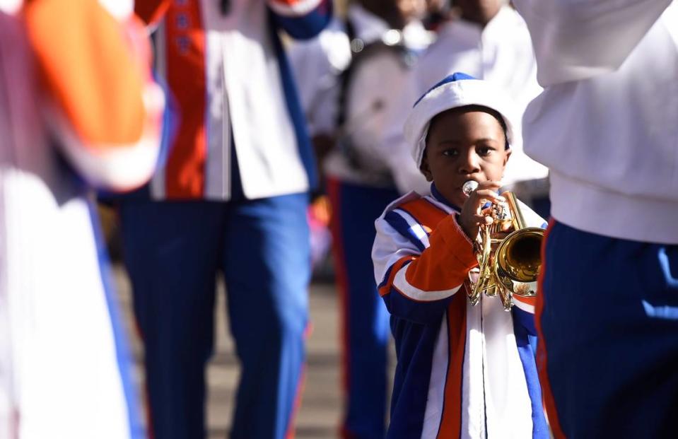 Five-year-old Desmond Kennedy blew his trumpet alongside the rest of the United House of Prayer Marching Band as they marched down Tryon Street in 2019 in the Novant Health Thanksgiving Parade. The 2021 version will be a night parade at 6 p.m. Nov. 24.