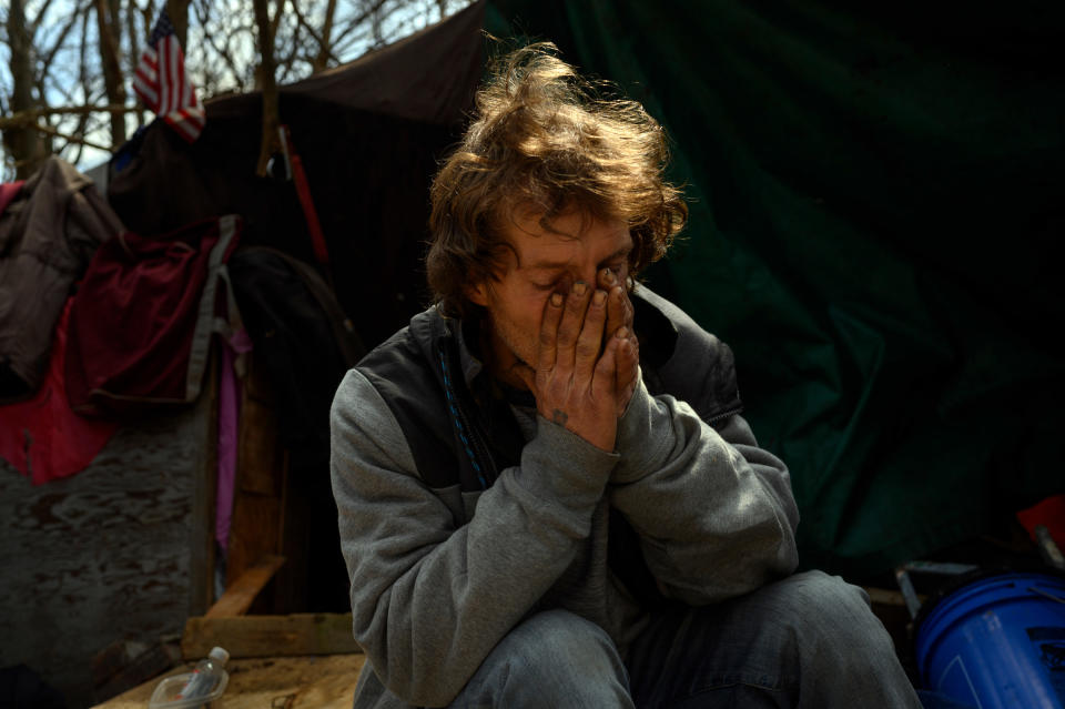 Ron at his hillside encampment on March 16, the day the winter shelter closed for the next nine months.<span class="copyright">Rebecca Kiger for TIME</span>