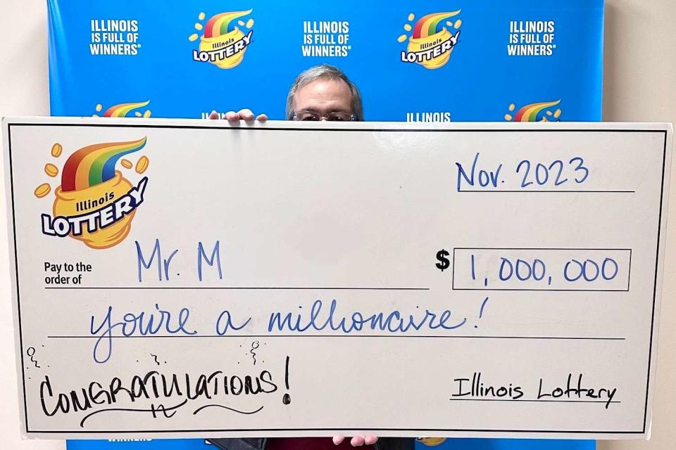 <p>illinois lottery</p> Mr. M receives his check for $1 million