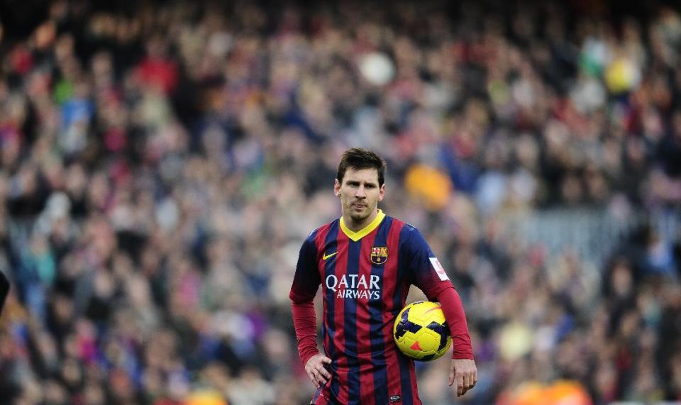 FC Barcelona's Lionel Messi, looks on against Valencia during a Spanish La Liga soccer match at the Camp Nou stadium in Barcelona, Spain, Saturday, Feb. 1, 2014. (AP Photo/Manu Fernandez)