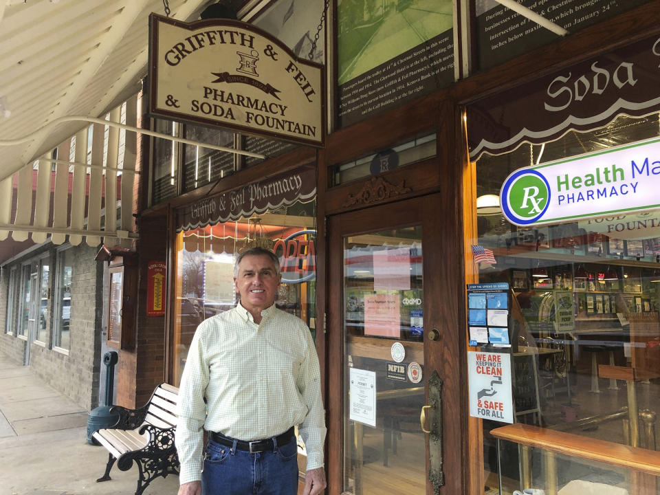 FILE - Ric Griffith appears outside of Griffith & Feil Pharmacy & Soda Fountain, a pharmacy he owns, on Jan. 15, 2021, in Kenova, W.Va. The pharmacy opened in 1892 with a soda fountain counter that was taken out in 1957 but reopened in 2004. (AP Photo/John Raby, File)