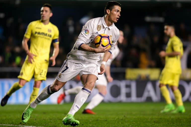 Real Madrid's forward Cristiano Ronaldo runs with the ball after scoring a goal on February 26, 2017