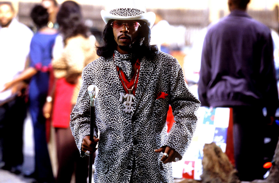 A closeup of Money Mike holding a cane in a scene from "Friday After Next"