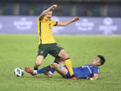 Australia's Mitchell Duke, top, and Chinese Taipei's Chen Wei Chuan fight for the ball during the World Cup 2022 Group B qualifying soccer match between Chinese Taipei and Australia in Kuwait City, Kuwait, Monday, June 7, 2021. (AP Photo/Jaber Abdulkhaleg)