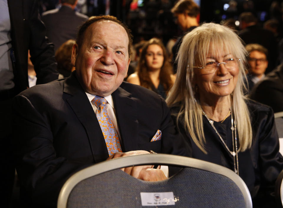 FILE - In this Sept. 26, 2016 file photo, Chief Executive of Las Vegas Sands Corporation Sheldon Adelson sits with his wife Miriam waits for the presidential debate between Democratic presidential nominee Hillary Clinton and Republican presidential nominee Donald Trump at Hofstra University in Hempstead, N.Y. Adelson, the billionaire mogul and power broker who built a casino empire spanning from Las Vegas to China and became a singular force in domestic and international politics has died after a long illness, his wife said Tuesday, Jan. 12, 2021.(AP Photo/Patrick Semansky, File)