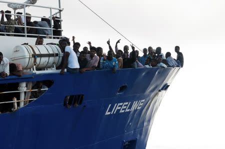 Migrants are seen on the deck of Mission Lifeline rescue boat in the central Mediterranean Sea, June 21, 2018. Picture taken June 21, 2018. Hermine Poschmann/Misson-Lifeline/Handout via REUTERS