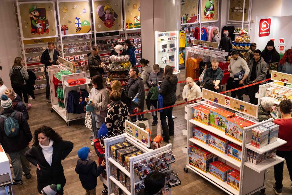 Shoppers line up at the Nintendo Store during Black Friday.