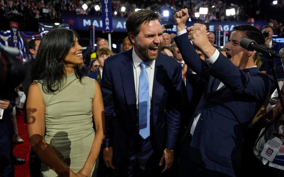 JD Vance and his wife Usha arrive on the floor with Ohio Senate candidate Bernie Moreno