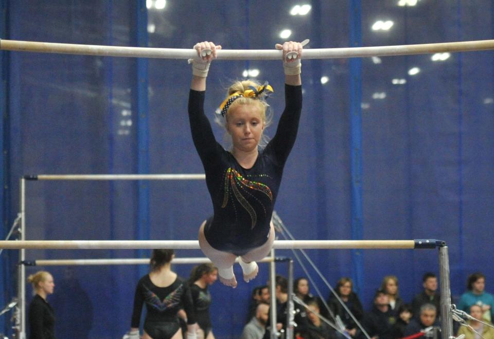 Hanover's Riley Clarke performs on the parallel bars during the Patriot League gymnastics meet at Starland in Hanover, Friday, Feb. 9, 2024.