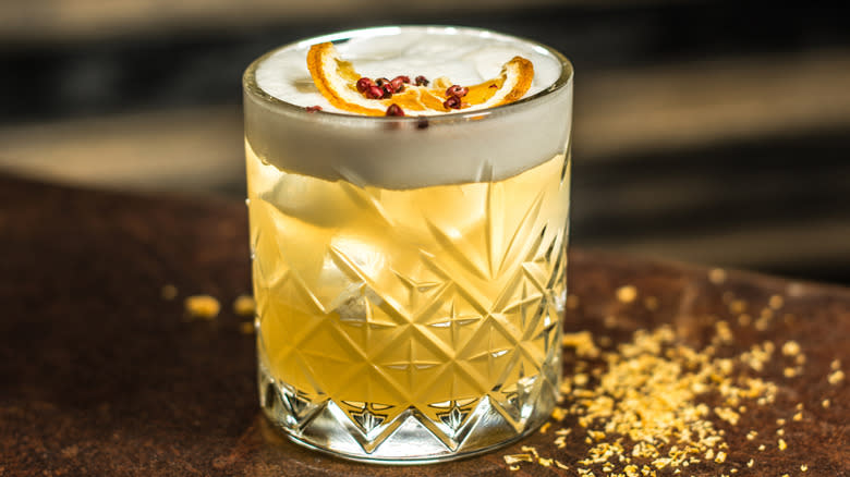 orange garnished whiskey sour