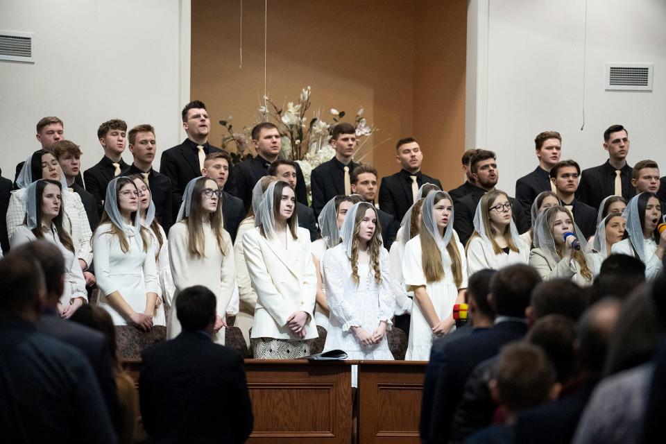 The choir sings during a recent Sunday service at Grace Evangelical Church, which has become a hub for refugees and holds services in Ukrainian, Russian, and English. For many refugees who fled their homes, Easter holds extra significance as a time of hope and new beginnings.