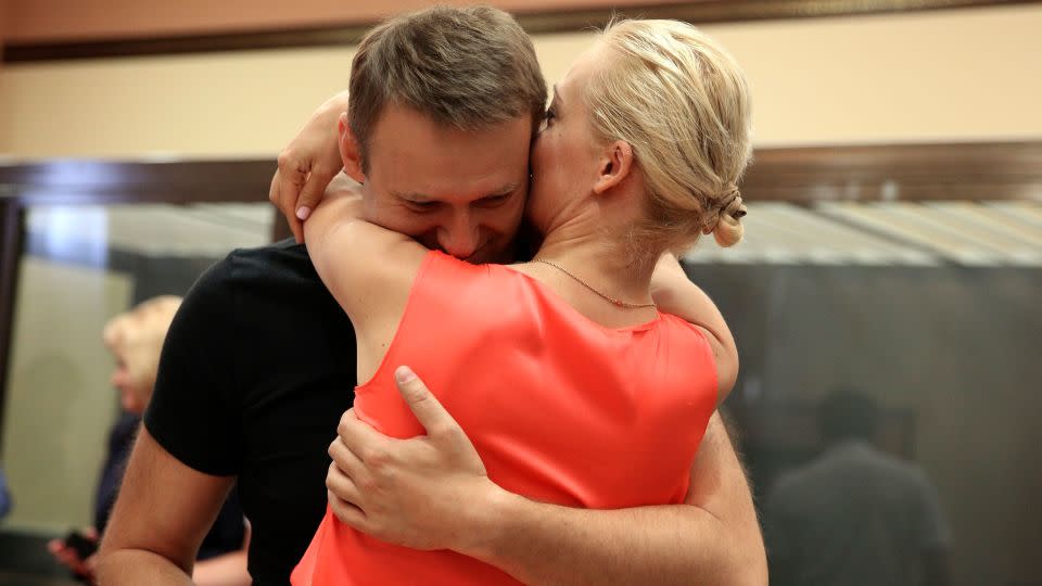 Russian opposition leader Alexey Navalny (left) and his wife Yulia Navalnaya (right) pictured in Kirov, Russia on July 19, 2013. Navalny represented the greatest threat to Putin's autocracy in his lifetime. - Evgeny Feldman/AP