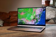 <p>Samsung Galaxy Book Pro 360 review pictures. Off-angle front view of the 15-inch Galaxy Book Pro 360 on a table in front of a brown couch.</p> 