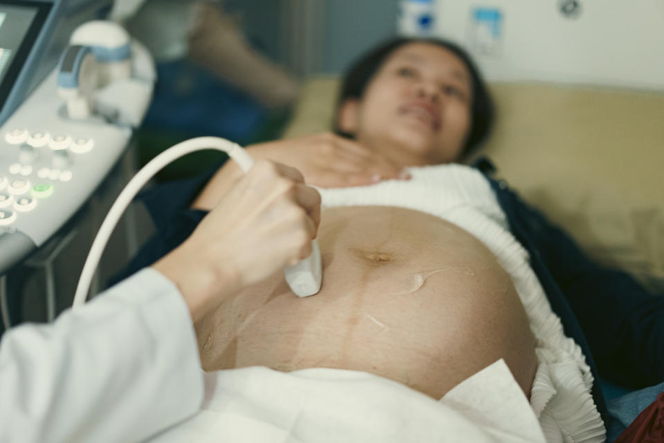 A pregnant woman getting an ultrasound