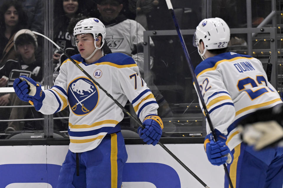 Buffalo Sabres right wing JJ Peterka (77) and ight wing Jack Quinn (22) celebrate Peterka's goal against the Los Angeles Kings during the first period of an NHL hockey game in Los Angeles, Wednesday, Jan. 24, 2024. (AP Photo/Alex Gallardo)