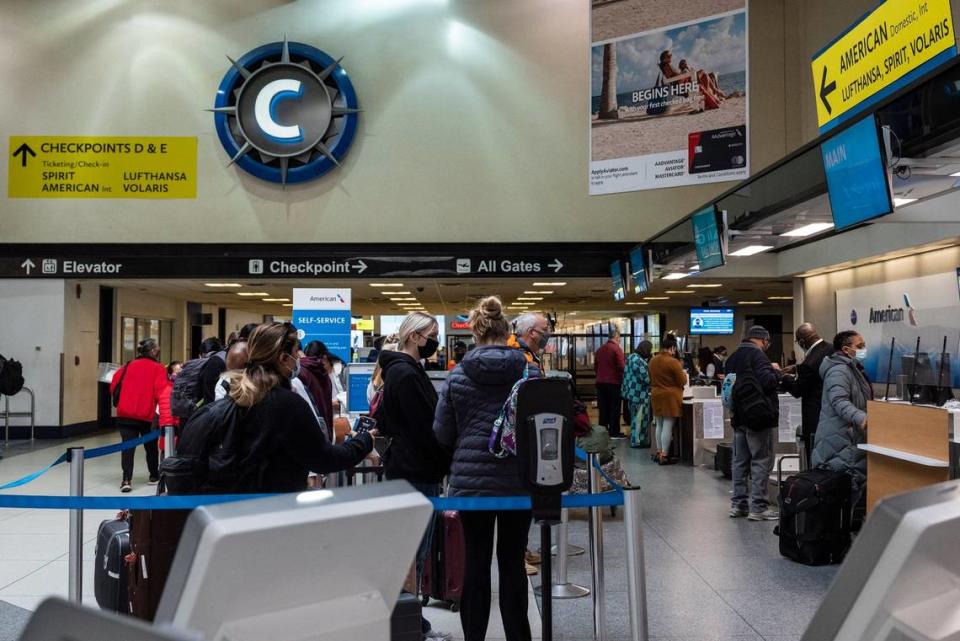 Travelers walk through the main terminal at Charlotte Douglas International Airport in 2022.  Record crowds are expected this summer.