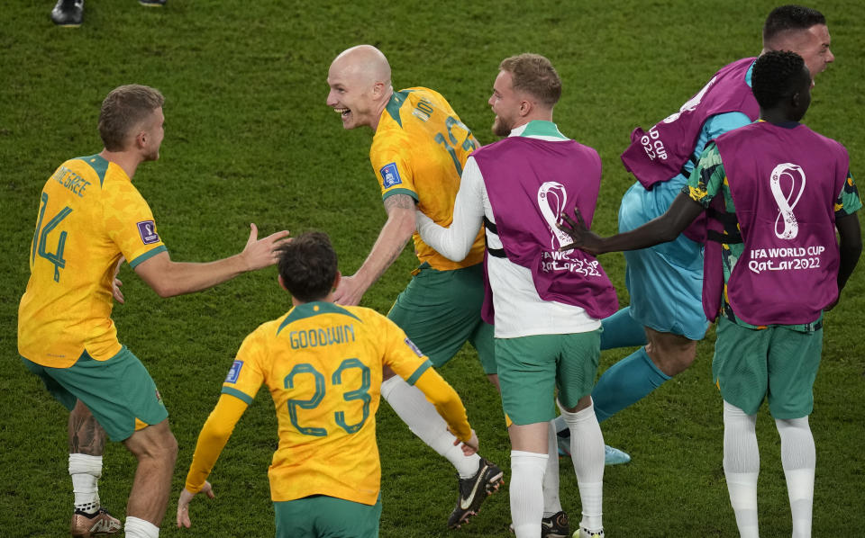 Australia's players celebrate their 1-0 victory at the end of the World Cup group D soccer match between Australia and Denmark, at the Al Janoub Stadium in Al Wakrah, Qatar, Wednesday, Nov. 30, 2022. (AP Photo/Themba Hadebe)