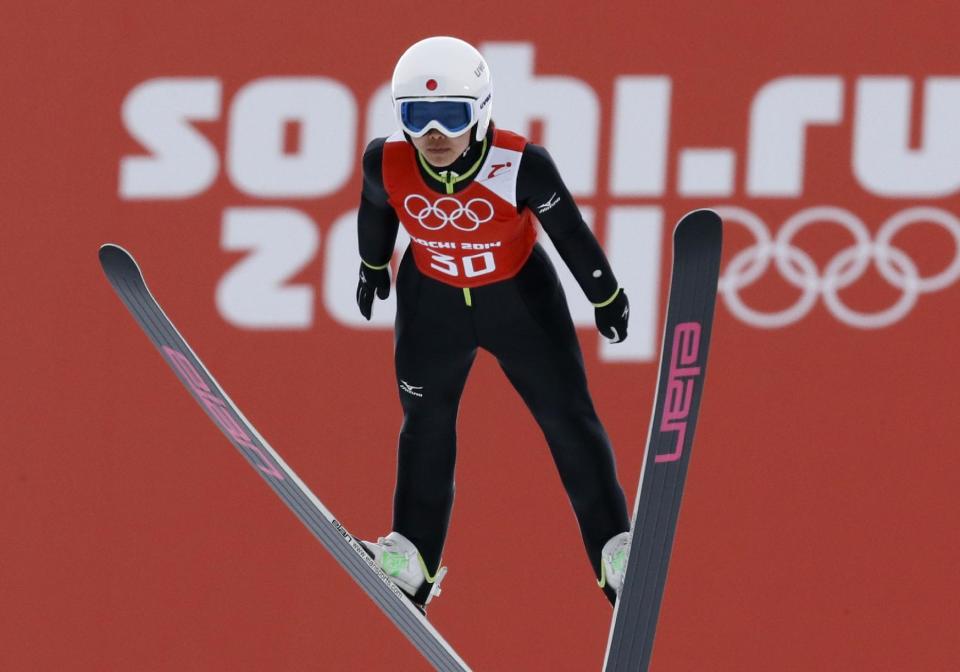 Japan's Sara Takanashi makes an attempt during a women's normal hill ski jumping training at the 2014 Winter Olympics, Sunday, Feb. 9, 2014, in Krasnaya Polyana, Russia. (AP Photo/Dmitry Lovetsky)