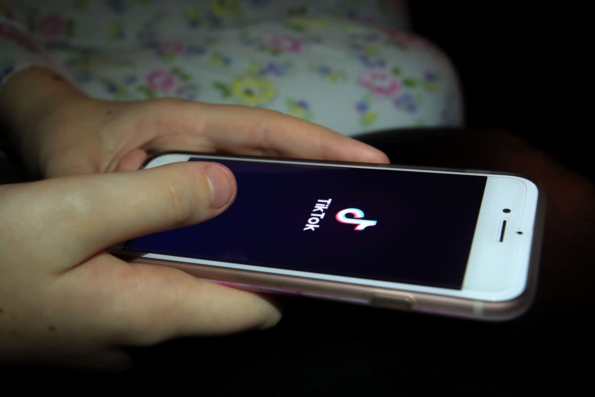 The TikTok video-sharing app is hugely popular among young people  (Peter Byrne / PA)