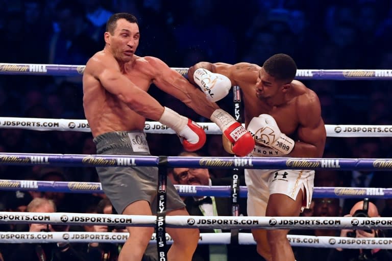 Britain's Anthony Joshua (right) throws a punch at Ukraine's Wladimir Klitschko during their world heavyweight title fight at Wembley Stadium, in London, in April 2017