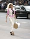 <p>When <em>Sex and the City </em>returned to the big screen, the world waited with bated breath for Ms. Bradshaw's updated wardrobe. This Ralph Lauren suit with the character's signature Manolo Blahniks didn't disappoint.</p>