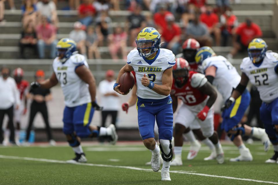 Delaware quarterback Nolan Henderson runs for a first down in the first quarter at Jacksonville State in the 2021 spring FCS quarterfinals.