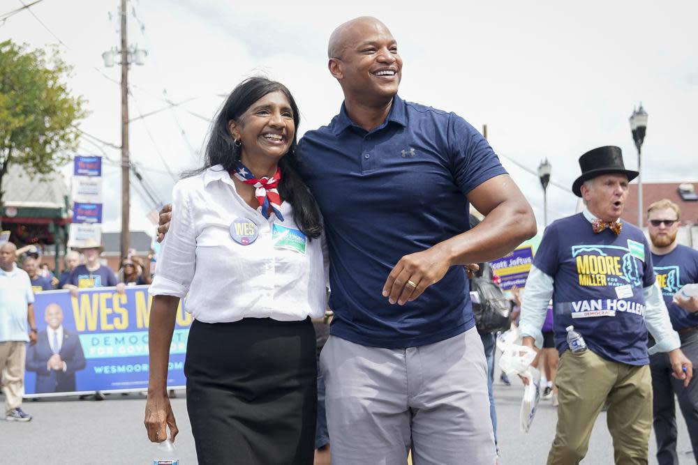 Maryland’s Democratic gubernatorial nominee Wes Moore, right, and lieutenant governor nominee Aruna Miller walk together during a Labor Day parade in Gaithersburg, Md., on Sept. 5, 2022. Moore could soon make history if elected Maryland’s first Black governor, and he’s not alone: Rep. Anthony Brown would be the state’s first Black attorney general. Miller would be Maryland’s first immigrant lieutenant governor, and the first Asian-American elected statewide. (AP Photo/Bryan Woolston, File)