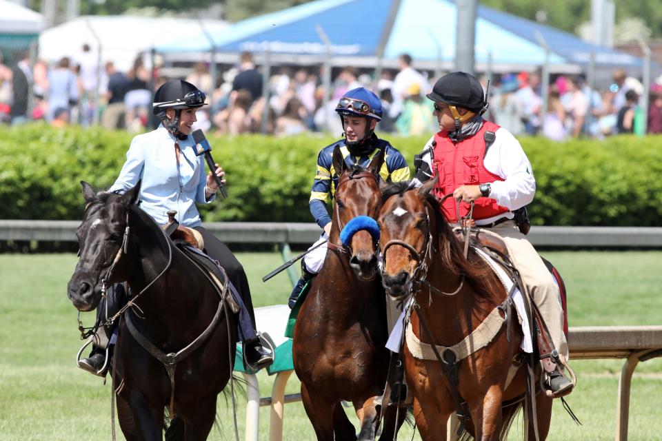 Donna Barton Brothers interviews a winning jockey while working for NBC Sports