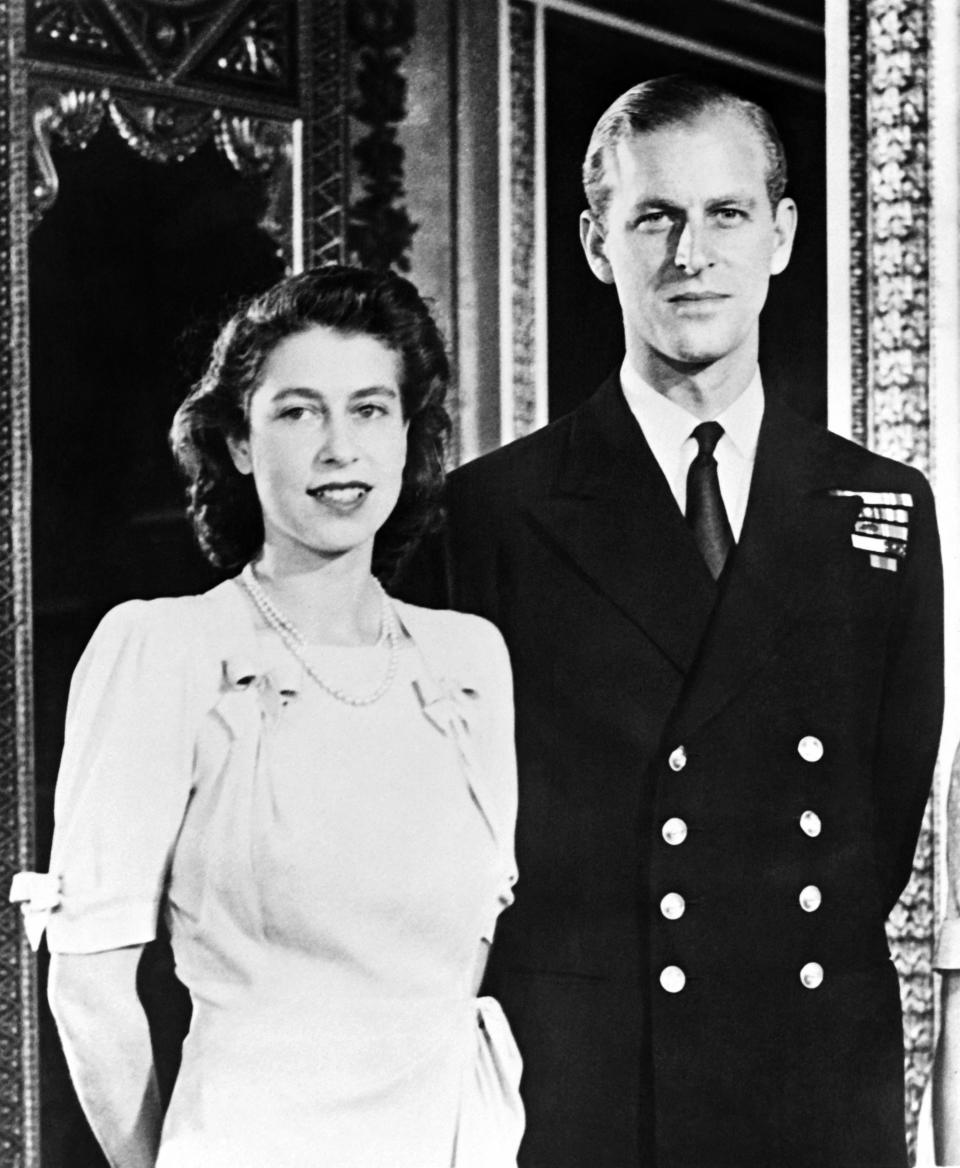 Queen Elizabeth II and Prince Philip, Duke of Edinburgh pose in 1947 before their wedding, in London. (Photo by AFP) (Photo by -/AFP via Getty Images)