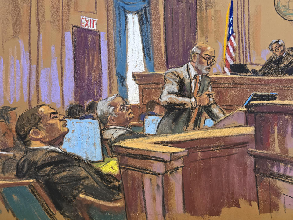 In this courtroom sketch, Wednesday, July 10, 2024, attorney Lawrence Lustberg, standing right, gives his closing arguments for Wael Hana, seated left, U.S. Sen. Robert Menendez is seated at center, and Judge Sidney Stein presides, upper right, in Manhattan federal court, in New York. (Jane Rosenberg via AP)