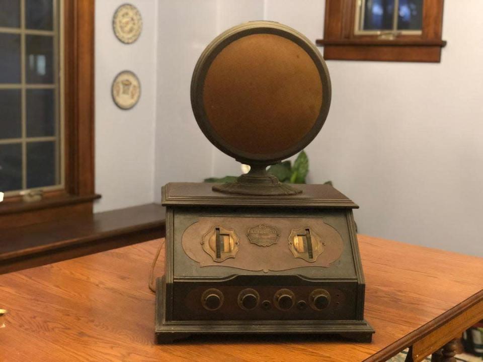 Amy and Bruce Eckert incorporated this 1920s-era radio that belong to Bruce&#39;s father in their basement speak-easy in Holland, Mich.