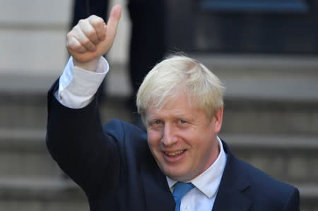 Boris Johnson, leader of the Britain's Conservative Party, leaves the party's headquarters in London