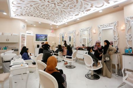 Muslim female customers are seen inside the Le'Jemalik Salon and Boutique ahead of the Eid al-Fitr Islamic holiday in Brooklyn, New York, U.S., June 23, 2017. REUTERS/Gabriela Bhaskar