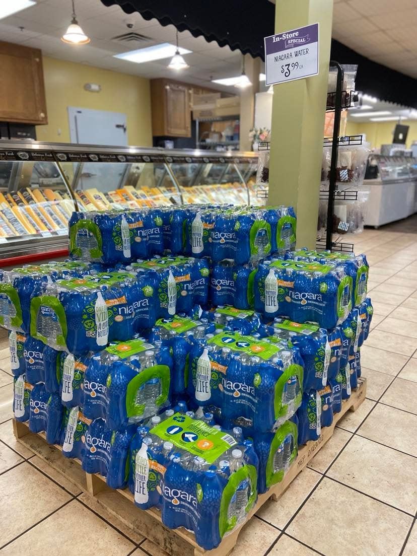 Bottled water awaits thirsty shoppers who've been without electricity since Tuesday morning. Walnut Creek Cheese store Manager Nick Blandin said his shop is also preparing for an influx of shoppers when power is restored.