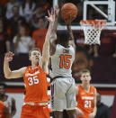 Virginia Tech's Jalen Cone (15) shoots over the defense Syracuse's Buddy Boeheim (35) during the first half of an NCAA college basketball game in Blacksburg Va., Saturday, Jan. 18 2020. (Matt Gentry/The Roanoke Times via AP)