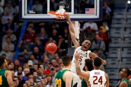 Mar 21, 2019; Hartford, CT, USA; Florida State Seminoles forward Mfiondu Kabengele (25) dunks and scores against the Vermont Catamounts during the second half off a game in the first round of the 2019 NCAA Tournament at XL Center. Mandatory Credit: David Butler II-USA TODAY Sports