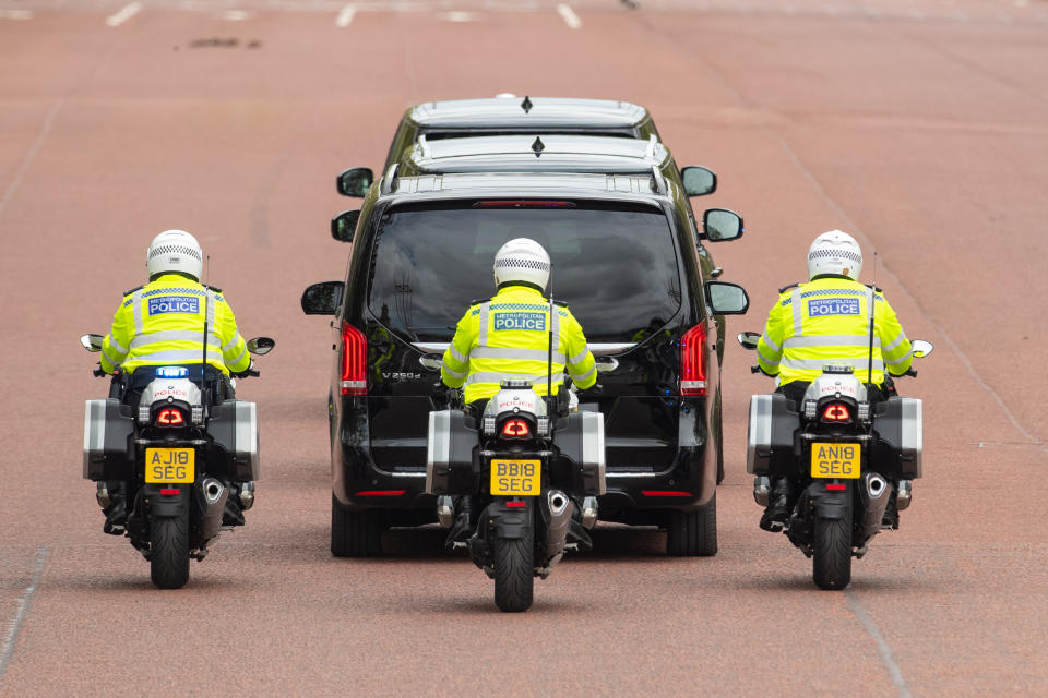 <p>The convoy carrying Queen Elizabeth II leaving Buckingham Palace by car to deliver the Queen's Speech during the State Opening of Parliament in the House of Lords at the Palace of Westminster in London. Picture date: Tuesday May 11, 2021.</p>
