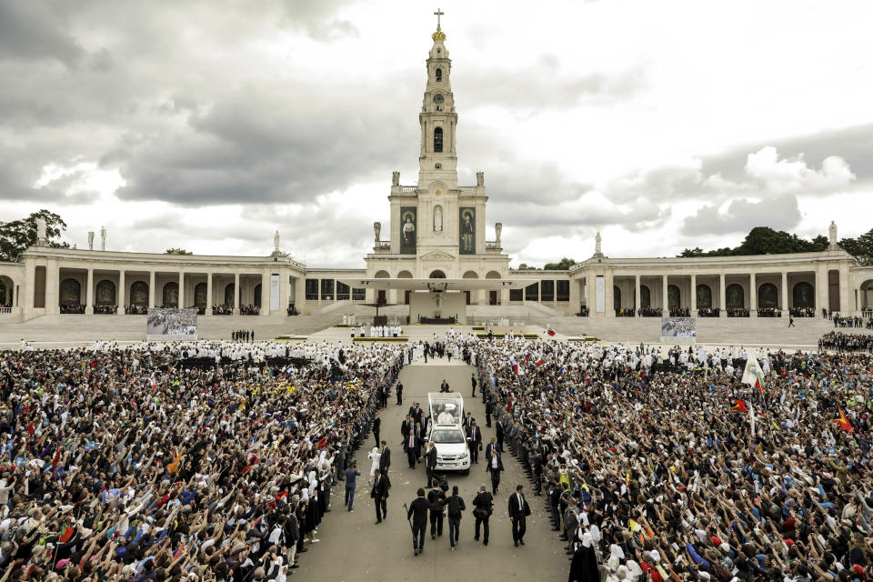 Pope Francis in his popemobile leaves at the end of a Mass where he canonized shepherd children Jacinta and Francisco Marto at the Sanctuary of Our Lady of Fatima, Saturday, Friday, May 13, 2017, in Fatima, Portugal. On Friday, May 17, 2024, the Vatican will issue revised norms for discerning apparitions "and other supernatural phenomena," updating a set of guidelines first issued in 1978. (Paulo Novais/Pool Photo via AP, File)