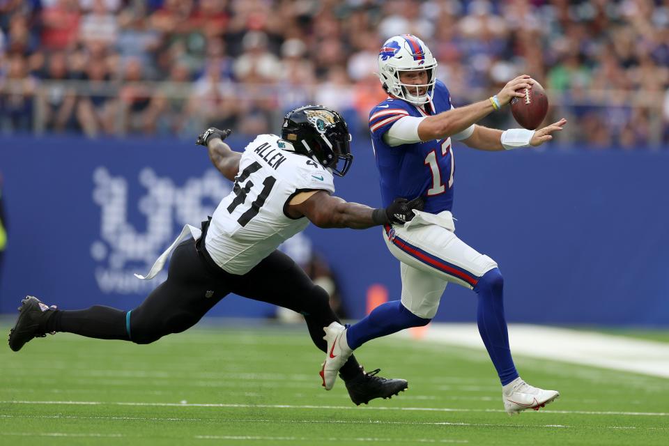 Buffalo Bills quarterback Josh Allen (17) is tackled by Jacksonville Jaguars linebacker Josh Allen (41) during an NFL football game between Jacksonville Jaguars and Buffalo Bills at the Tottenham Hotspur stadium in London, Sunday, Oct. 8, 2023. (AP Photo/Ian Walton)