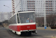 In this Saturday, Feb. 2, 2019, photo, people ride on a tram in Pyongyang, North Korea. Pyongyang is upgrading its overcrowded mass transit system with brand new subway cars, trams and buses in a campaign meant to show leader Kim Jong Un is raising the country's standard of living. (AP Photo/Dita Alangkara)